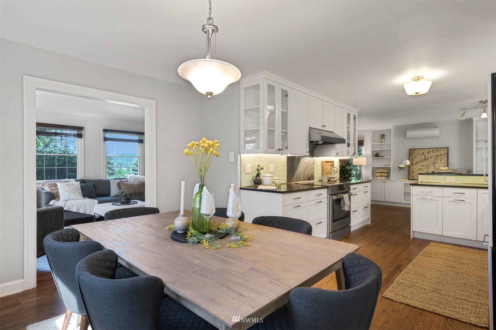 622 Everglade Road Bellingham, WA 98225 - Photo 5 of 38 a kitchen with refrigerator dining table and chairs