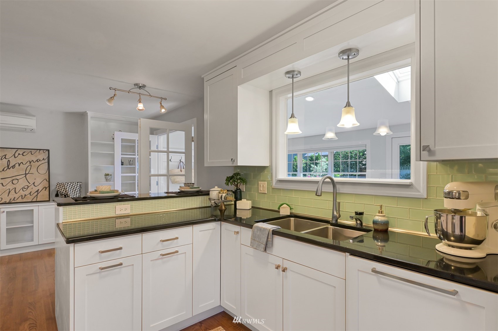 622 Everglade Road Bellingham, WA 98225 - Photo 8 of 38 a kitchen with a sink window and cabinets