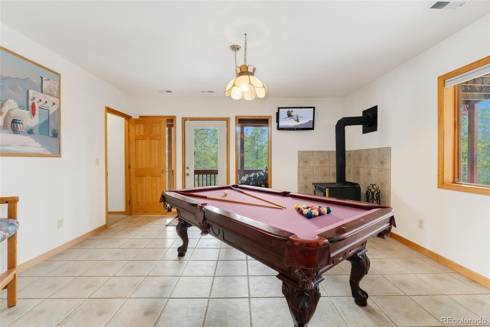 660 Coyote Circle Black Hawk, CO 80422 - Photo 16 of 46 a room with pool table and windows