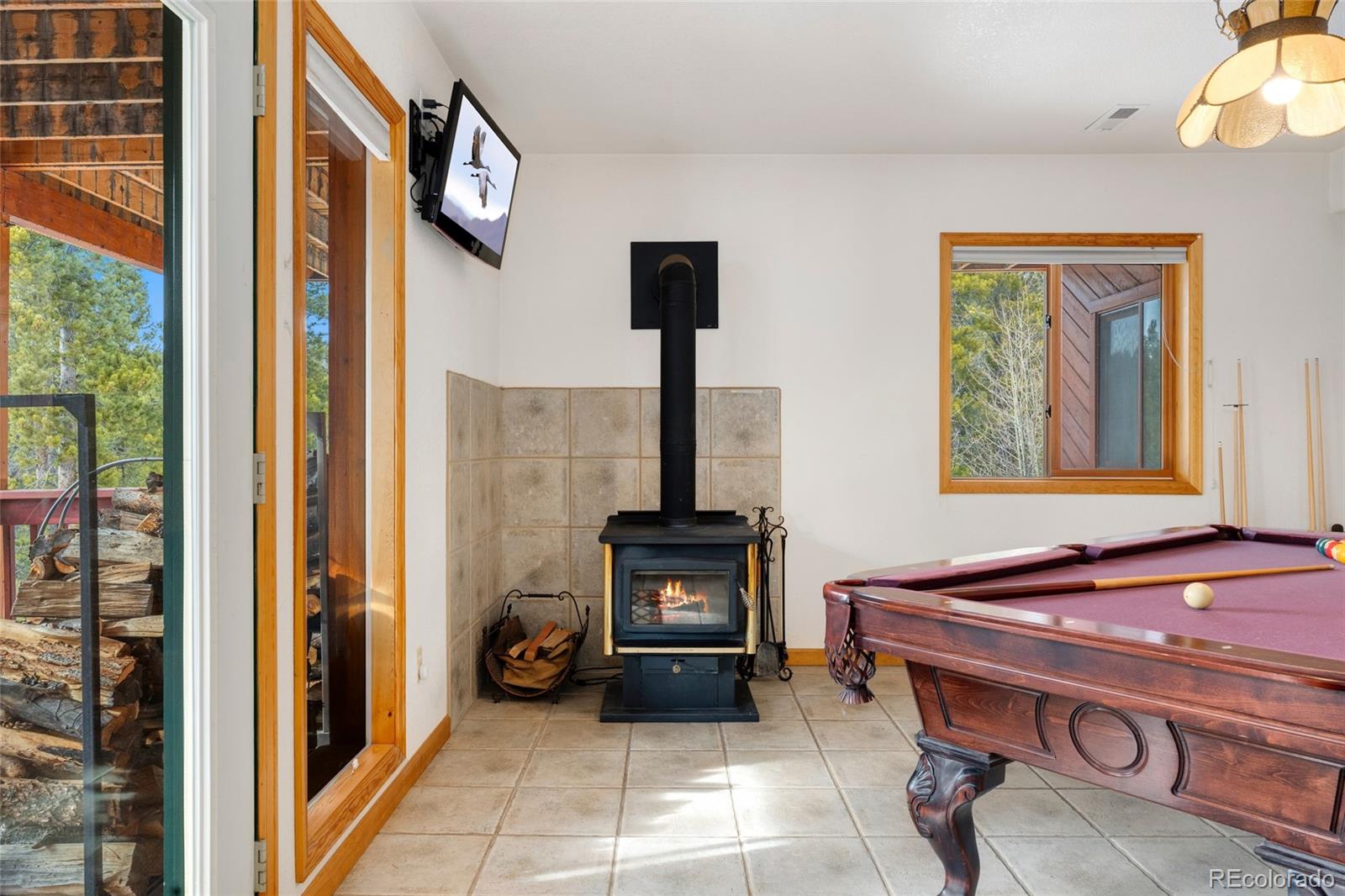 660 Coyote Circle Black Hawk, CO 80422 - Photo 17 of 46 a living room with furniture and a fireplace