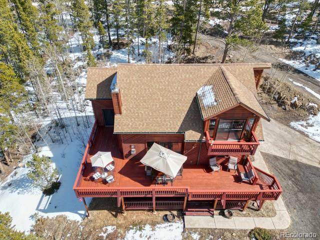 660 Coyote Circle Black Hawk, CO 80422 - Photo 38 of 46 an aerial view of a house with swimming pool and outdoor seating