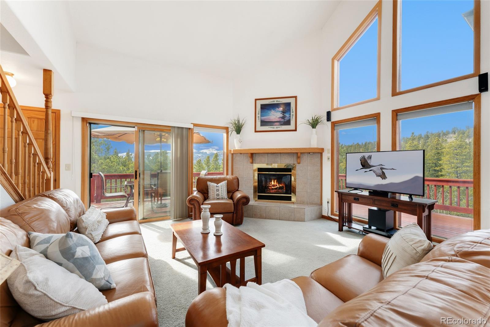 660 Coyote Circle Black Hawk, CO 80422 - Photo 4 of 46 a living room with furniture fireplace and a large window