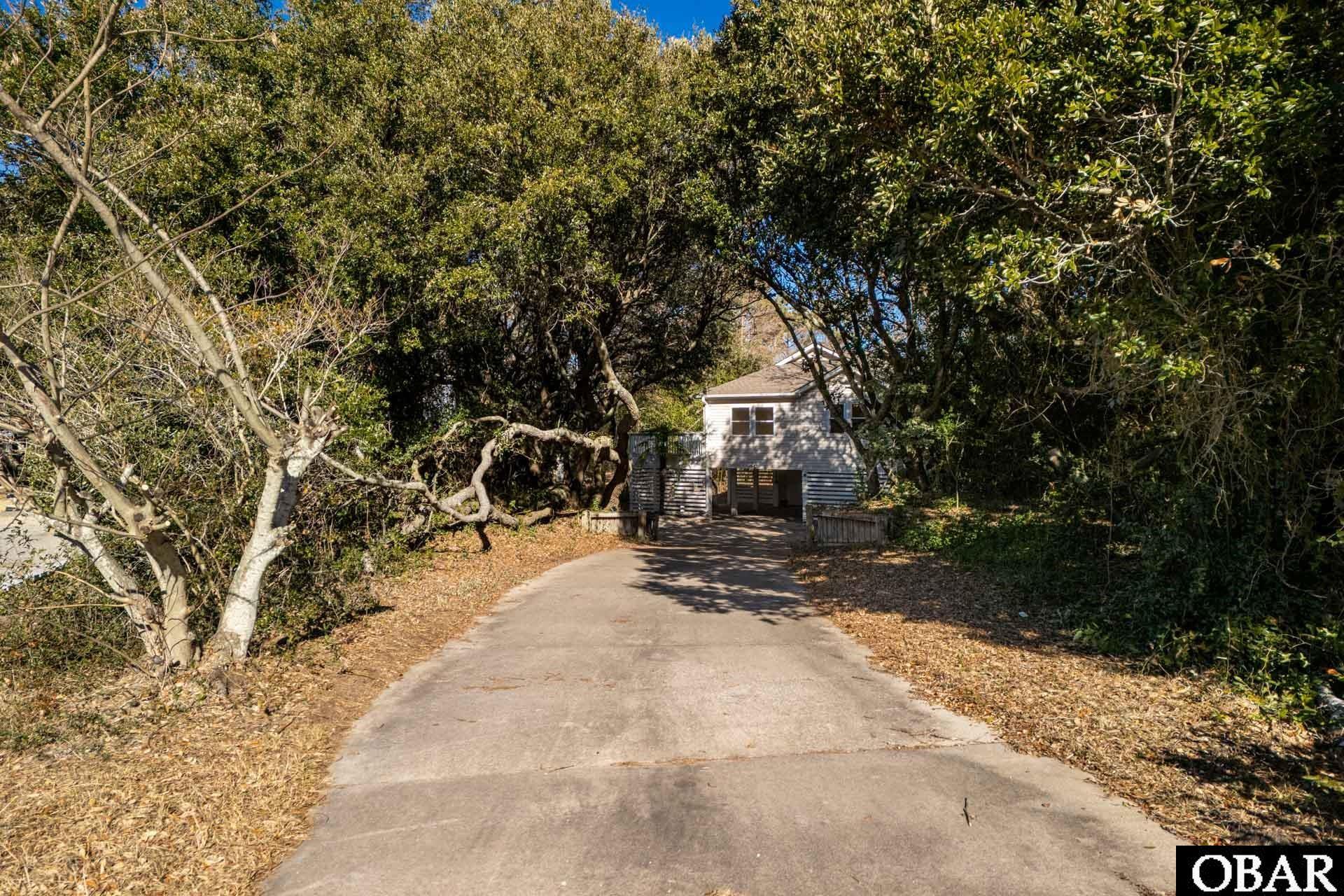 3611 Rabbit Hollow, Unit 26 Kitty Hawk, NC 27949 - Photo 48 of 50 Tree Lined Driveway
