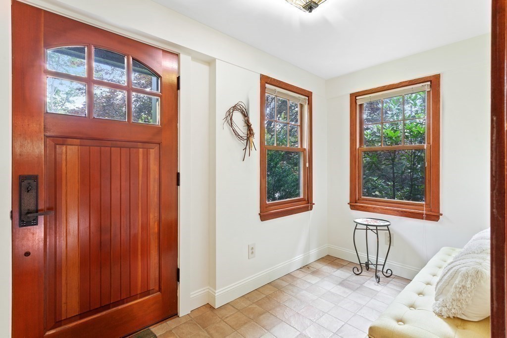 28 Radcliffe Road Arlington, MA 02474 - Photo 3 of 38 a view of a livingroom with wooden floor and a window