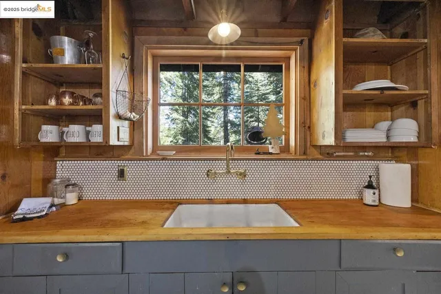 a bathroom with a bathtub and window