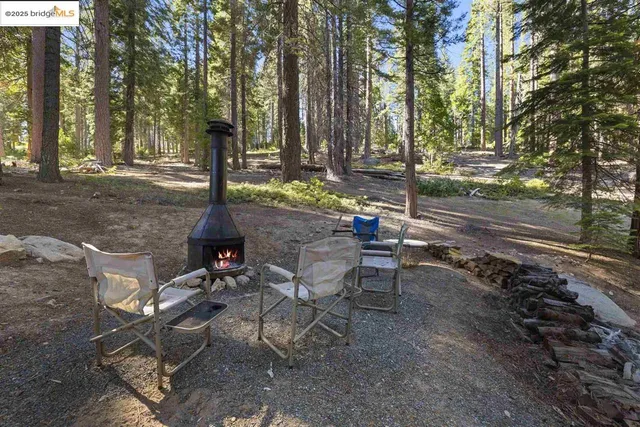 a view of a backyard with sitting area