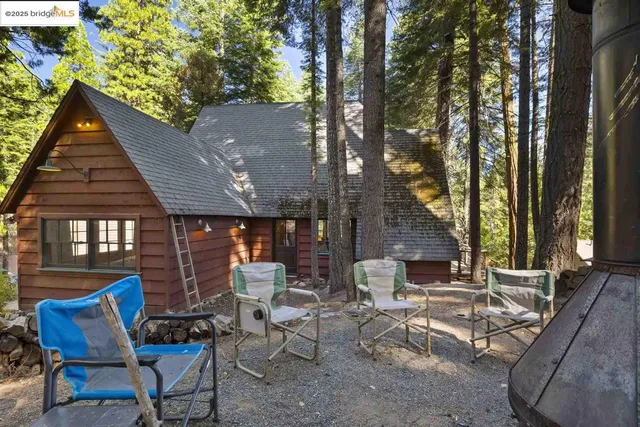 a view of patio with table and chairs and potted plants