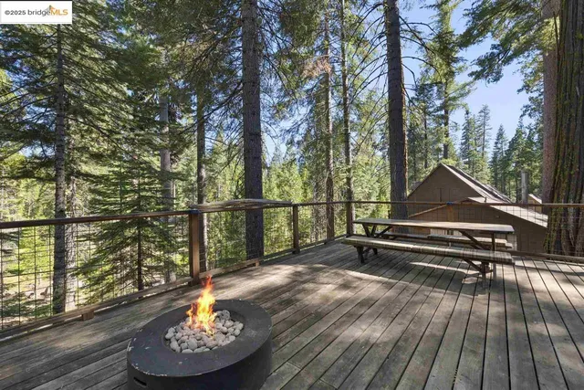 a park view with a bench and wooden floor