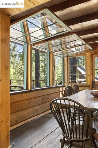 a view of a chairs and table in the balcony