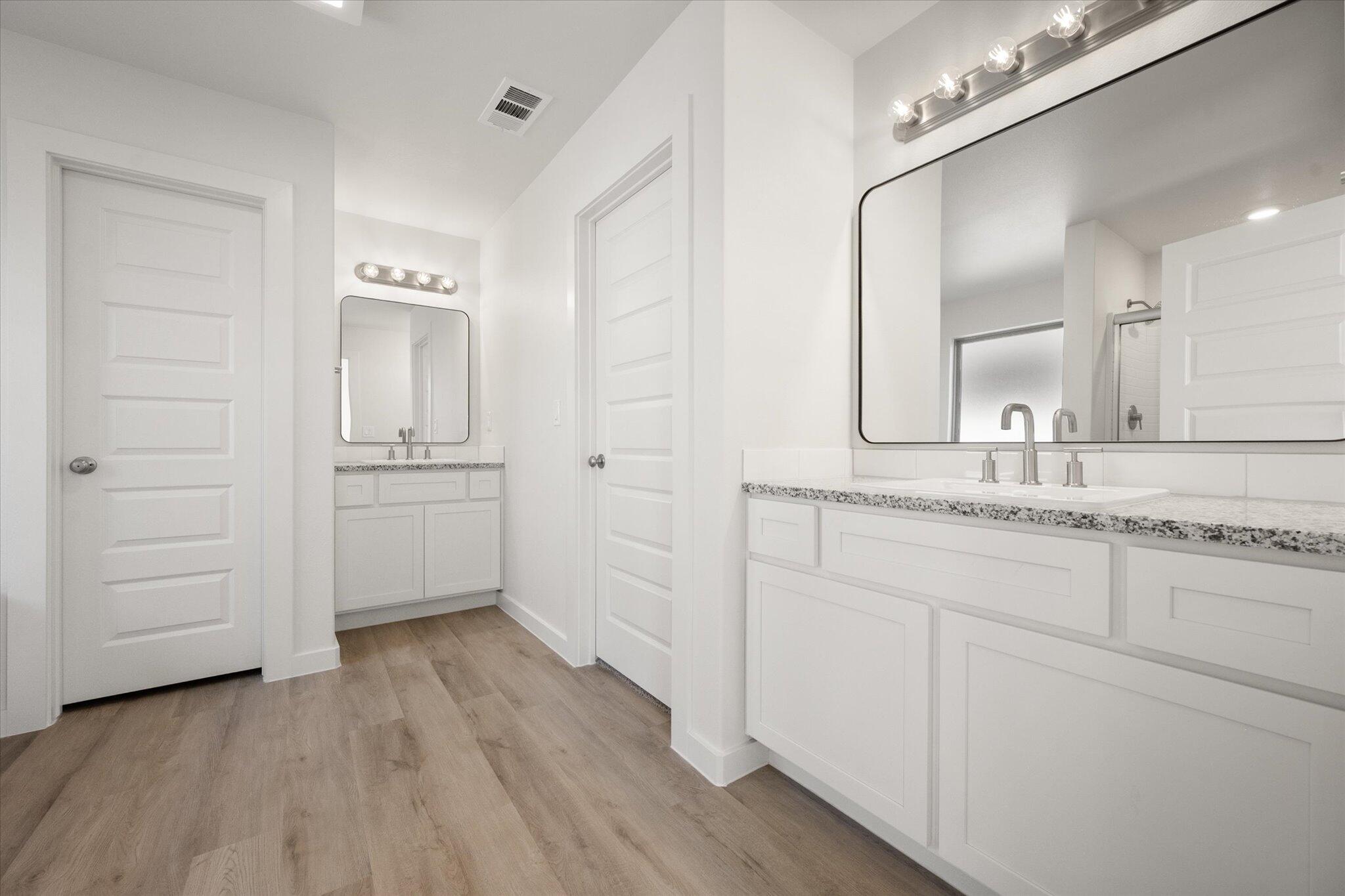 3003 138th Place Lubbock, TX 79423 - Photo 13 of 21 a bathroom with a sink and a mirror