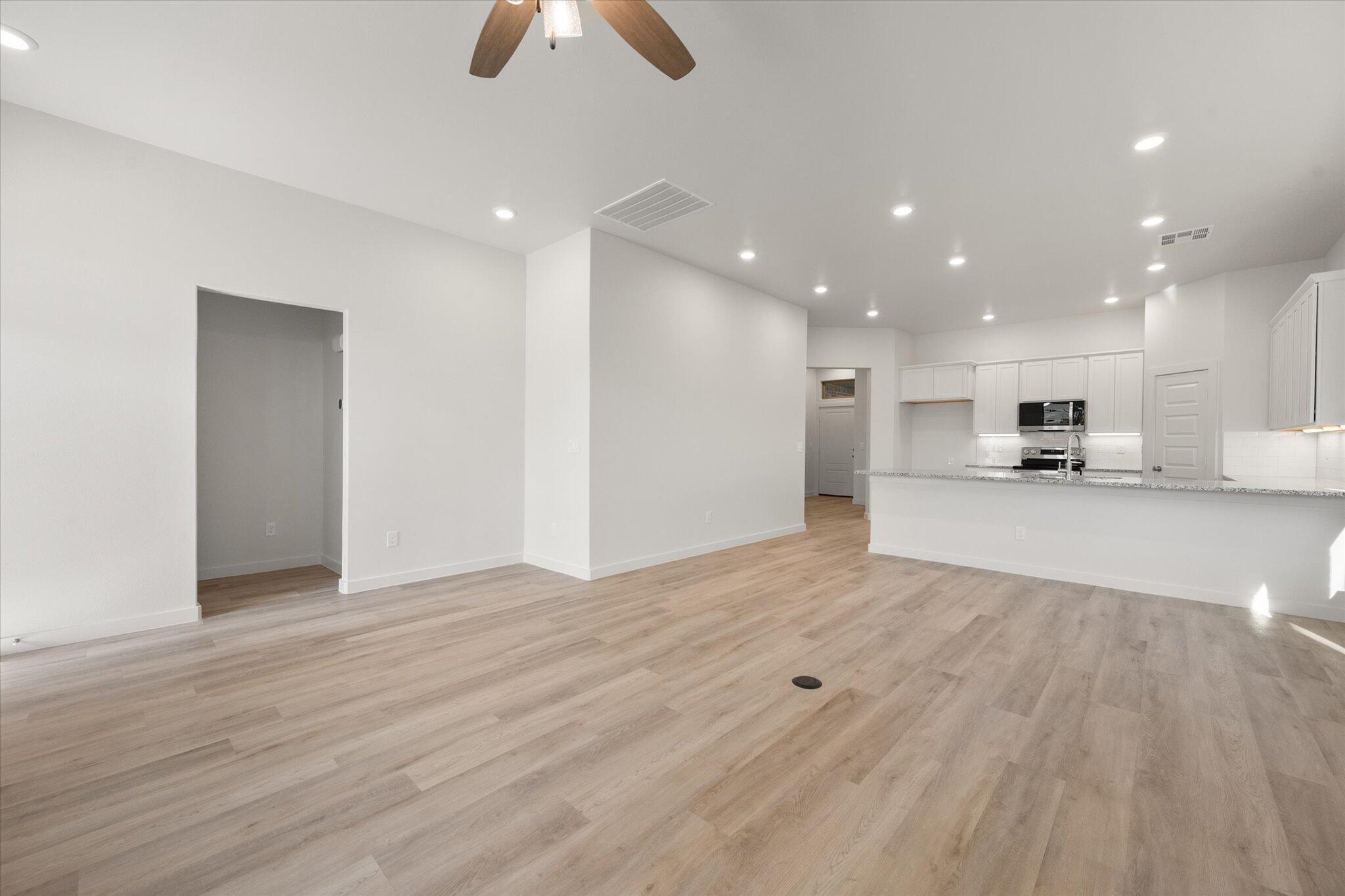 3003 138th Place Lubbock, TX 79423 - Photo 9 of 21 a view of kitchen with wooden floor and window