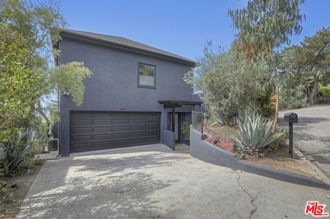 4357 Cedarhurst Circle Los Angeles, CA 90027 - Photo 2 of 51 a house with a tree in front of it