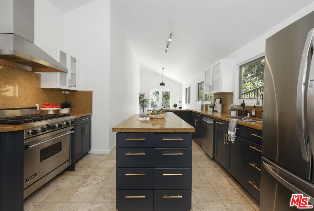 4357 Cedarhurst Circle Los Angeles, CA 90027 - Photo 15 of 51 a kitchen with a stove sink and refrigerator