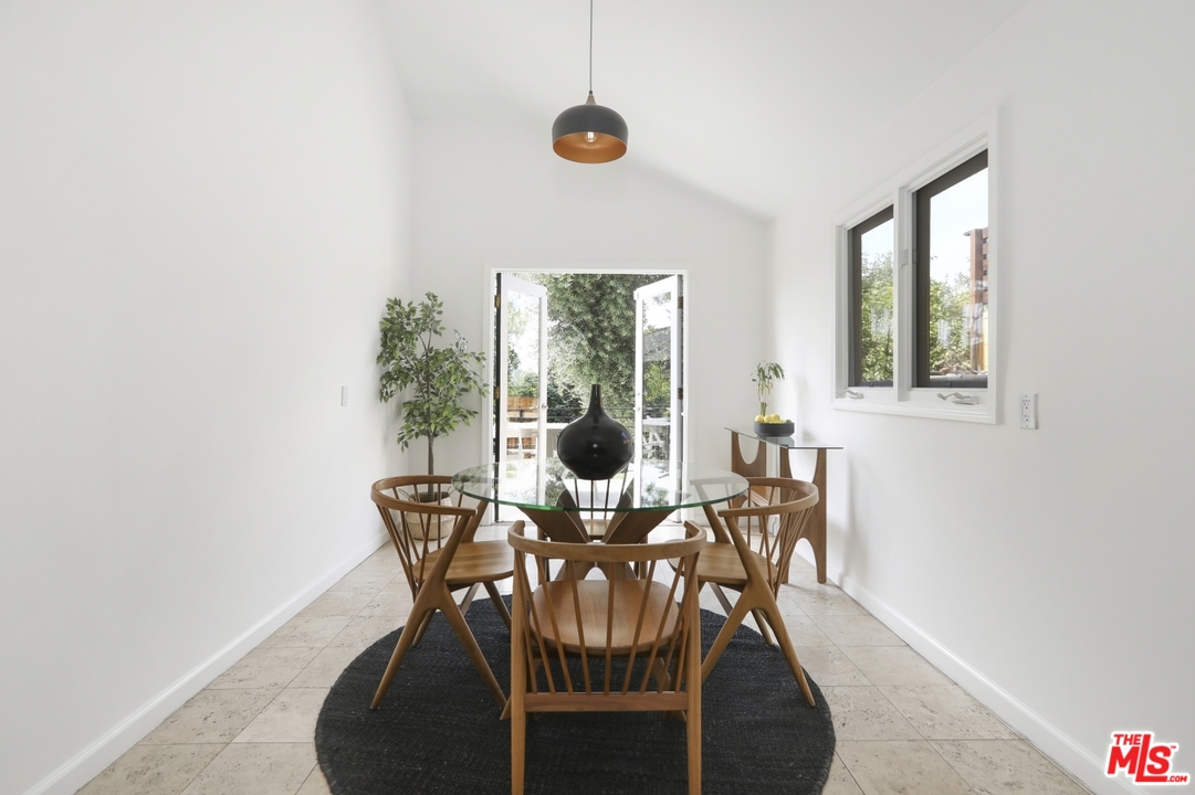 4357 Cedarhurst Circle Los Angeles, CA 90027 - Photo 17 of 51 a view of a dining room with furniture window and outside view