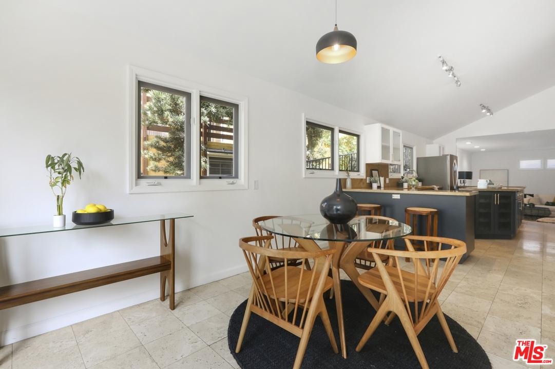 4357 Cedarhurst Circle Los Angeles, CA 90027 - Photo 18 of 51 a view of a dining room with furniture and windows