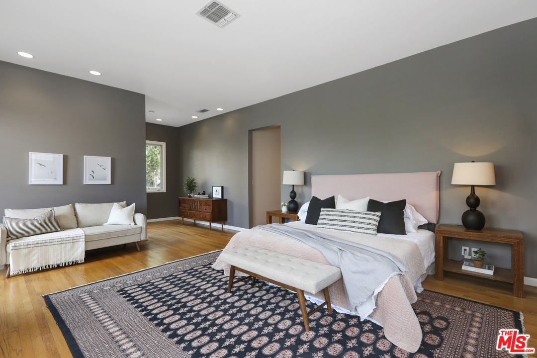 4357 Cedarhurst Circle Los Angeles, CA 90027 - Photo 23 of 51 a bedroom with a bed and wooden floor