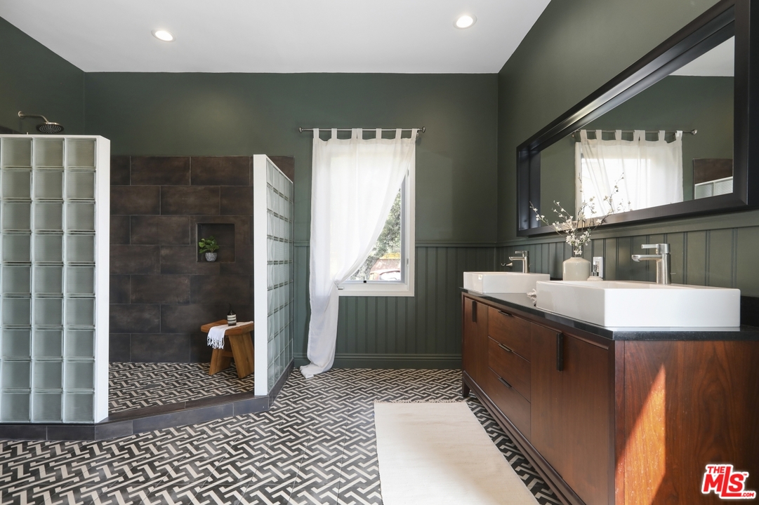 4357 Cedarhurst Circle Los Angeles, CA 90027 - Photo 31 of 51 a bathroom with a sink a toilet and shower