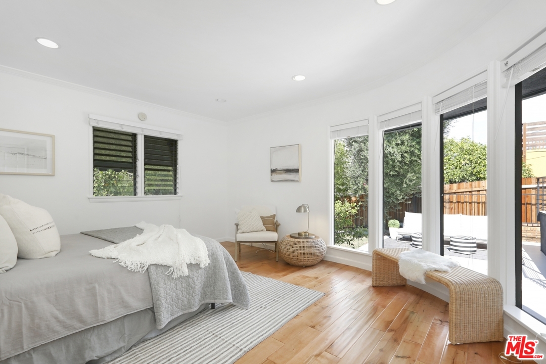 4357 Cedarhurst Circle Los Angeles, CA 90027 - Photo 36 of 51 a bedroom with a large bed and large windows