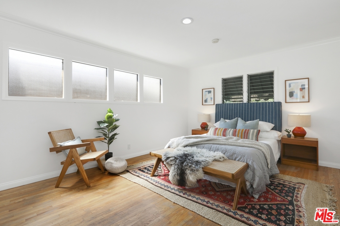 4357 Cedarhurst Circle Los Angeles, CA 90027 - Photo 40 of 51 a bed room with a bed and a chair
