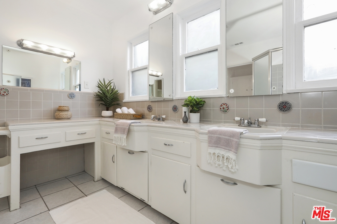 4357 Cedarhurst Circle Los Angeles, CA 90027 - Photo 43 of 51 a bathroom with a sink and a mirror