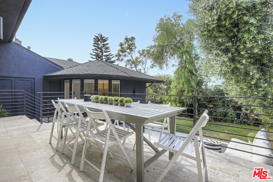 4357 Cedarhurst Circle Los Angeles, CA 90027 - Photo 45 of 51 a patio with a table and chairs and potted plants