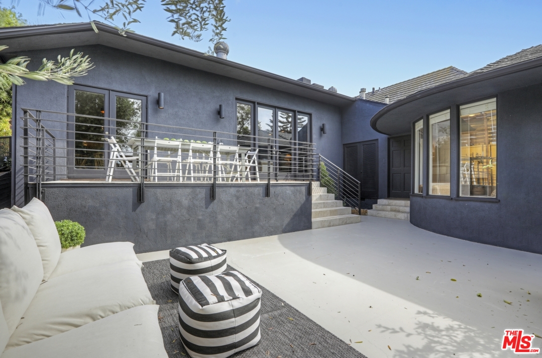 4357 Cedarhurst Circle Los Angeles, CA 90027 - Photo 46 of 51 a view of a patio with couches chairs and potted plants