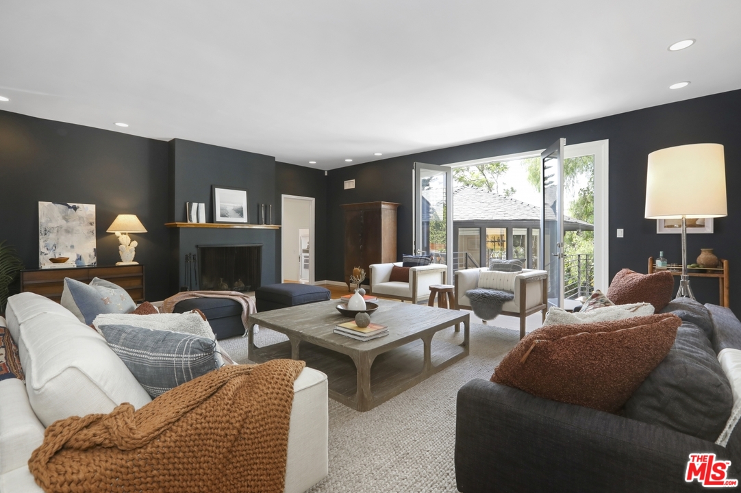 4357 Cedarhurst Circle Los Angeles, CA 90027 - Photo 9 of 51 a living room with furniture fireplace and a large window