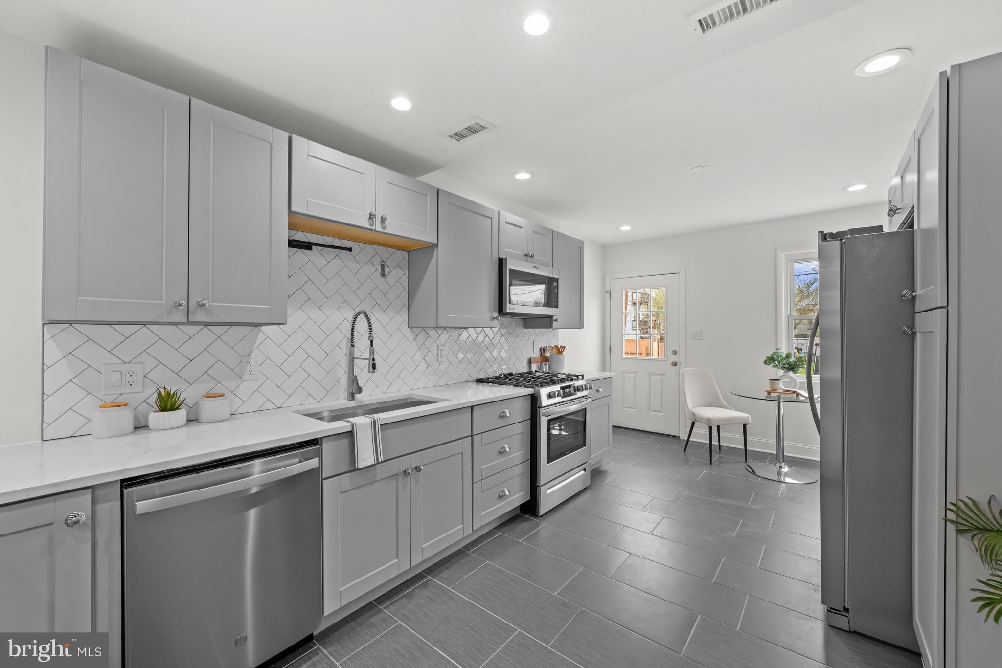 112 15th Street Southeast Washington, DC 20003 - Photo 6 of 18 Kitchen with access to back patio