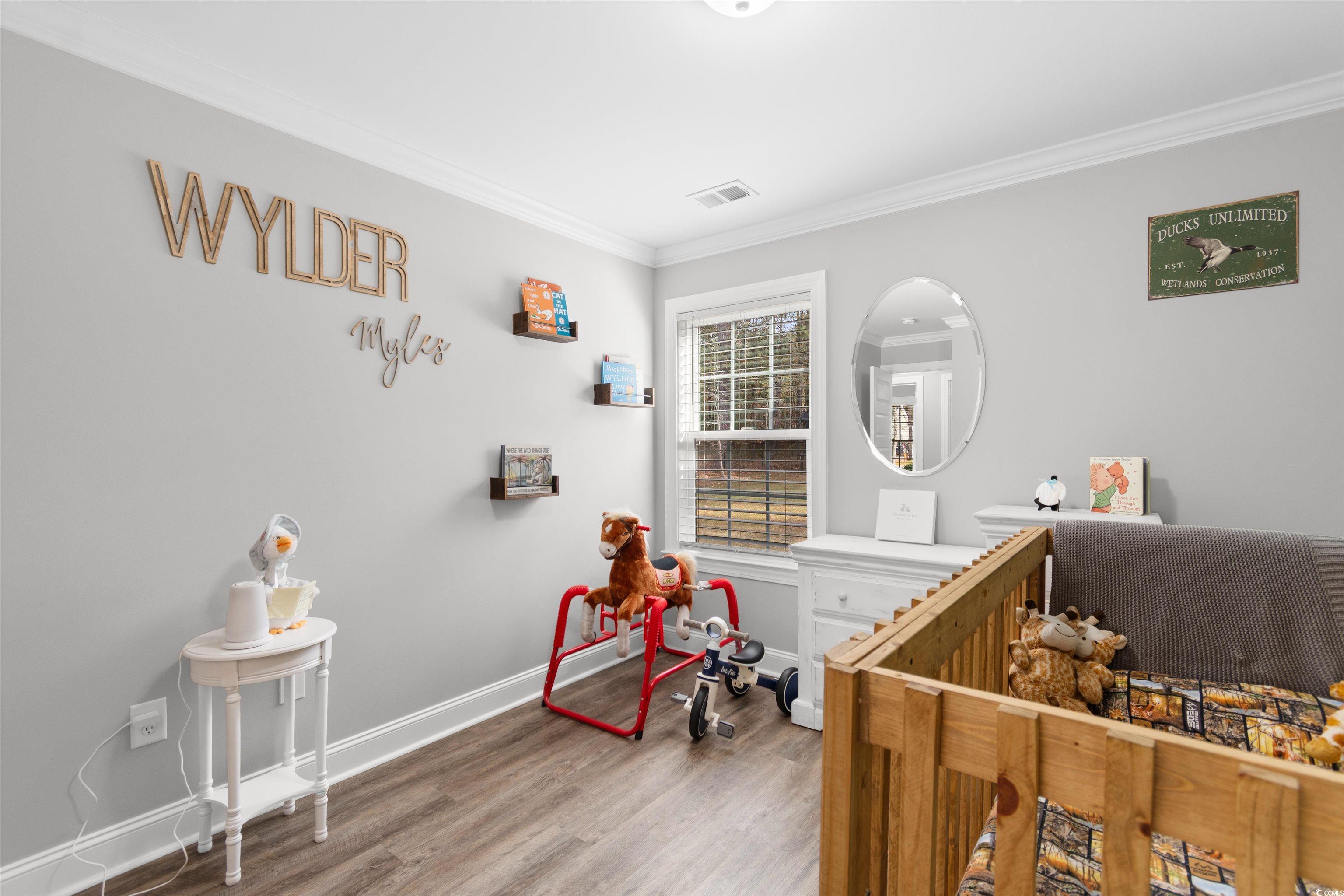 1275 Pinetucky Drive Galivants Ferry, SC 29544 - Photo 21 of 39 Bedroom with light wood-style floors and crown molding