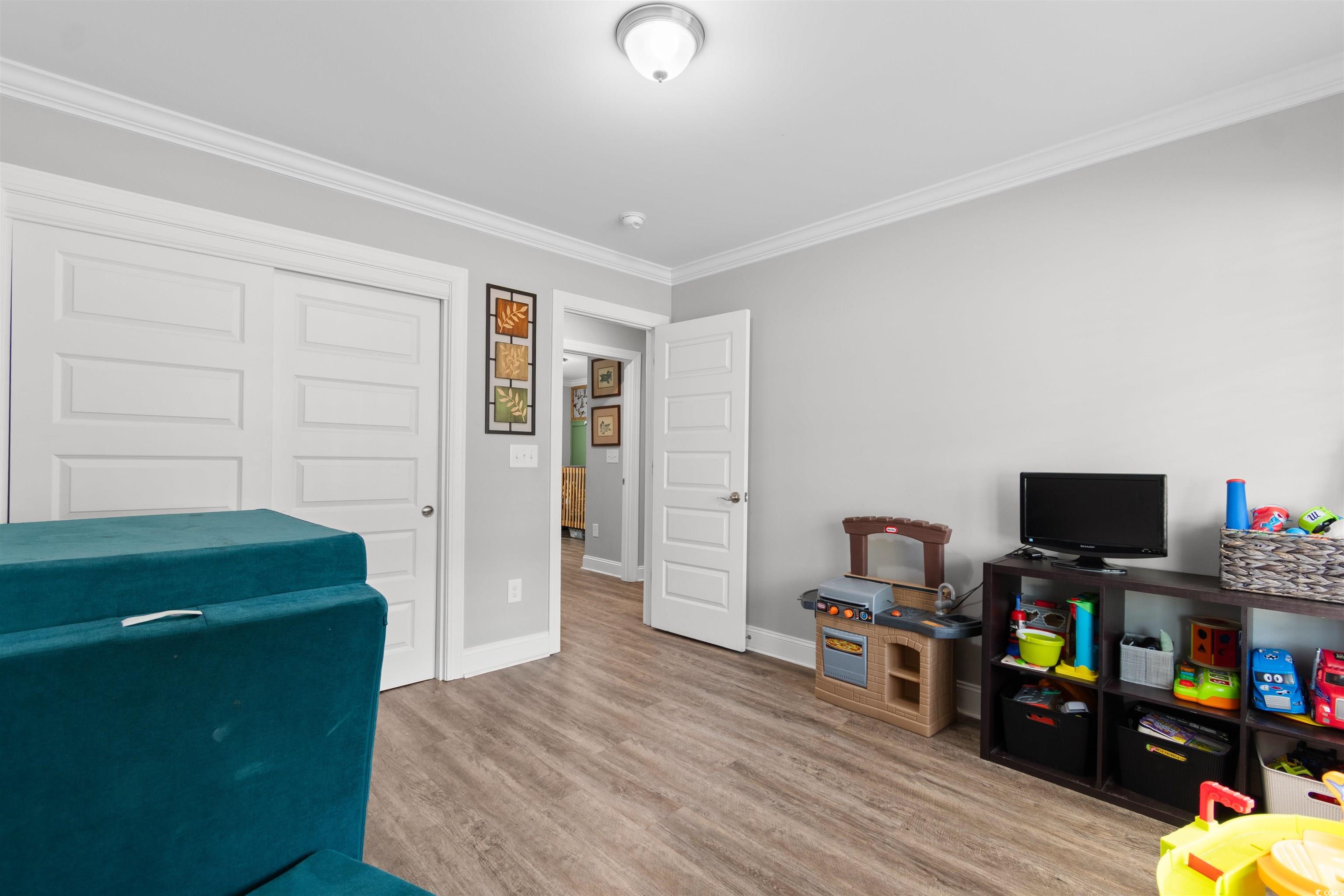 1275 Pinetucky Drive Galivants Ferry, SC 29544 - Photo 23 of 39 Playroom with crown molding and light wood-style floors