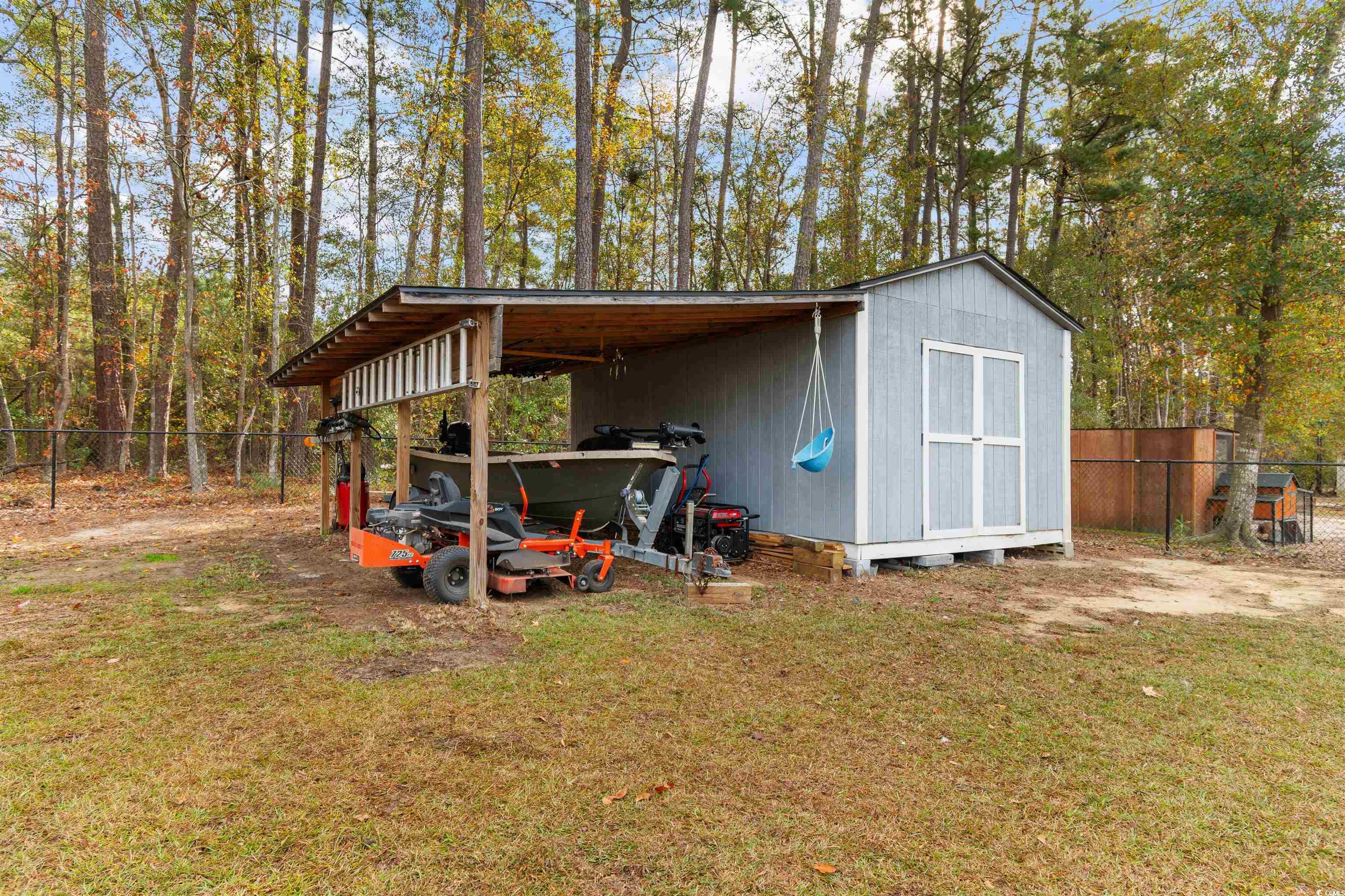 1275 Pinetucky Drive Galivants Ferry, SC 29544 - Photo 31 of 39 View of shed featuring a carport