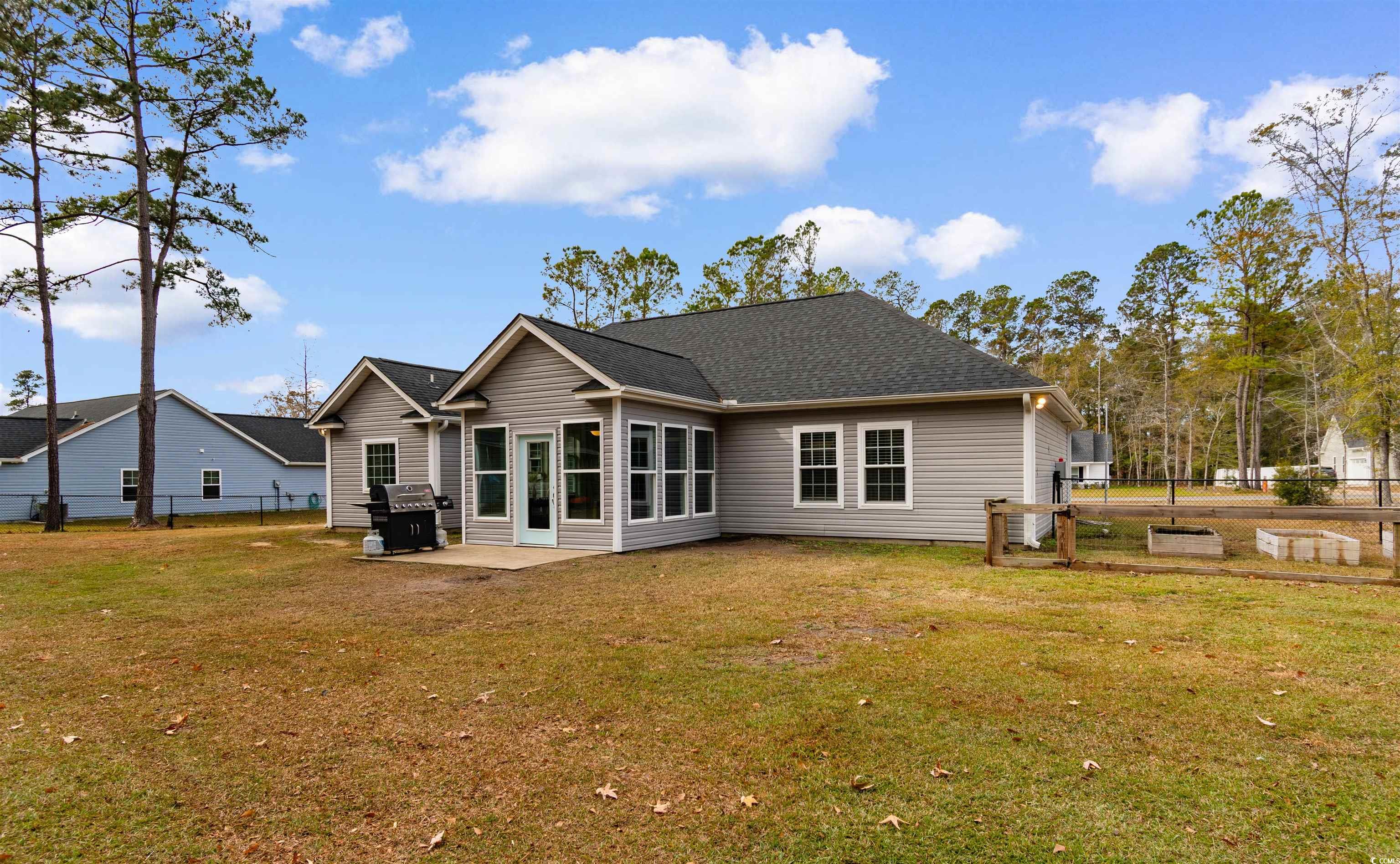 1275 Pinetucky Drive Galivants Ferry, SC 29544 - Photo 36 of 39 Rear view of property featuring a patio area and a shingled roof