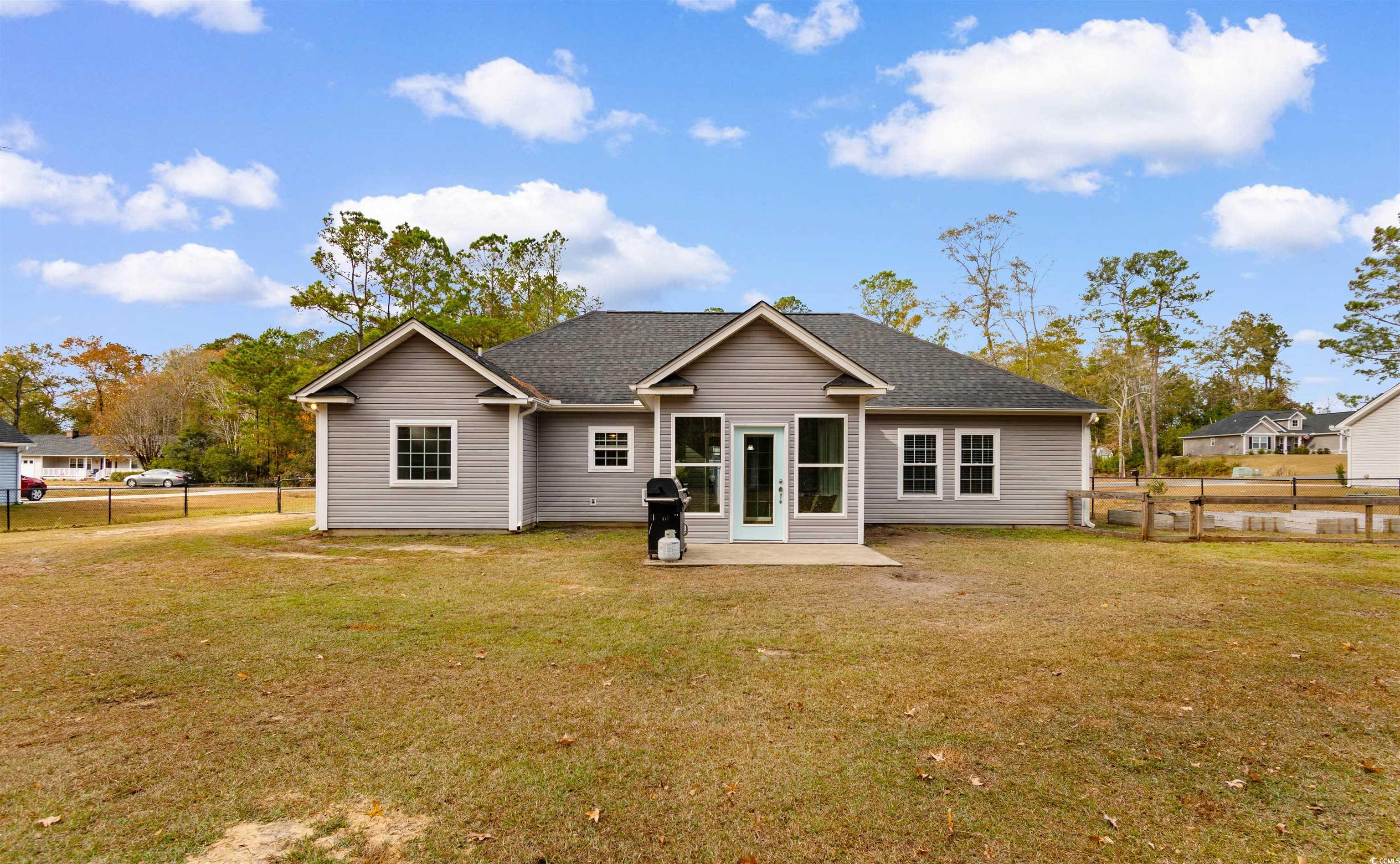 1275 Pinetucky Drive Galivants Ferry, SC 29544 - Photo 37 of 39 Back of house with a patio area and a shingled roof