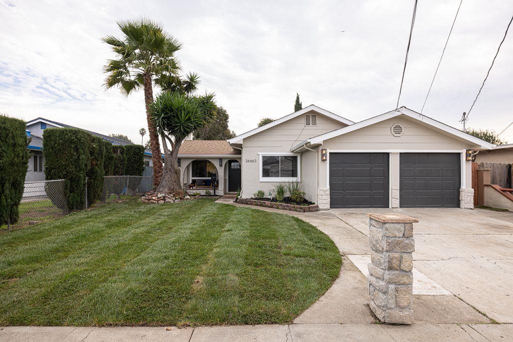 36663 Munyan Street Newark, CA 94560 - Photo 1 of 1 a front view of a house with a yard