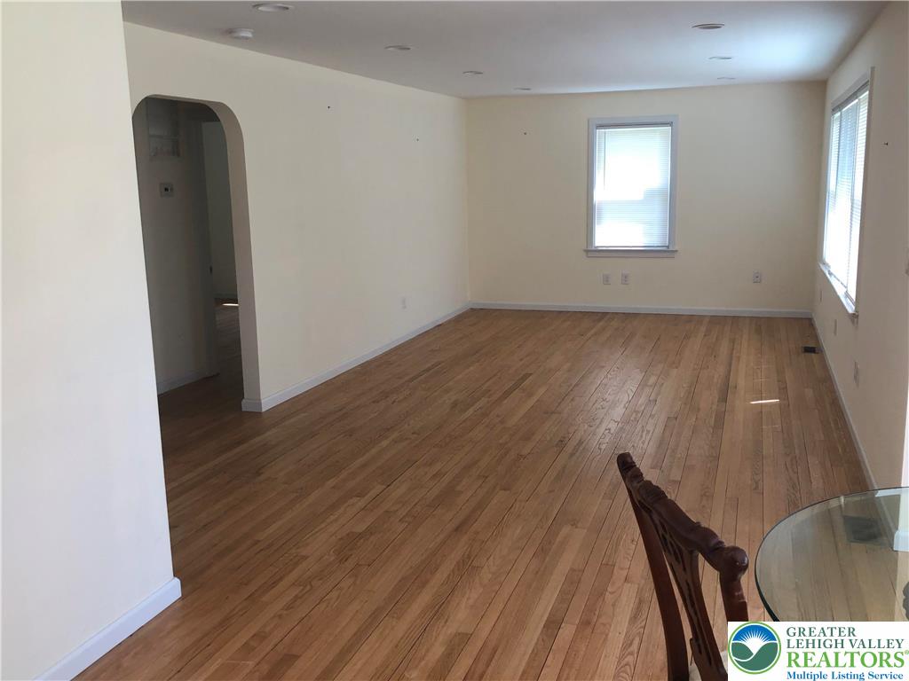 1931 Meadows Road Hellertown, PA 18055 - Photo 11 of 20 an empty room with wooden floor and windows
