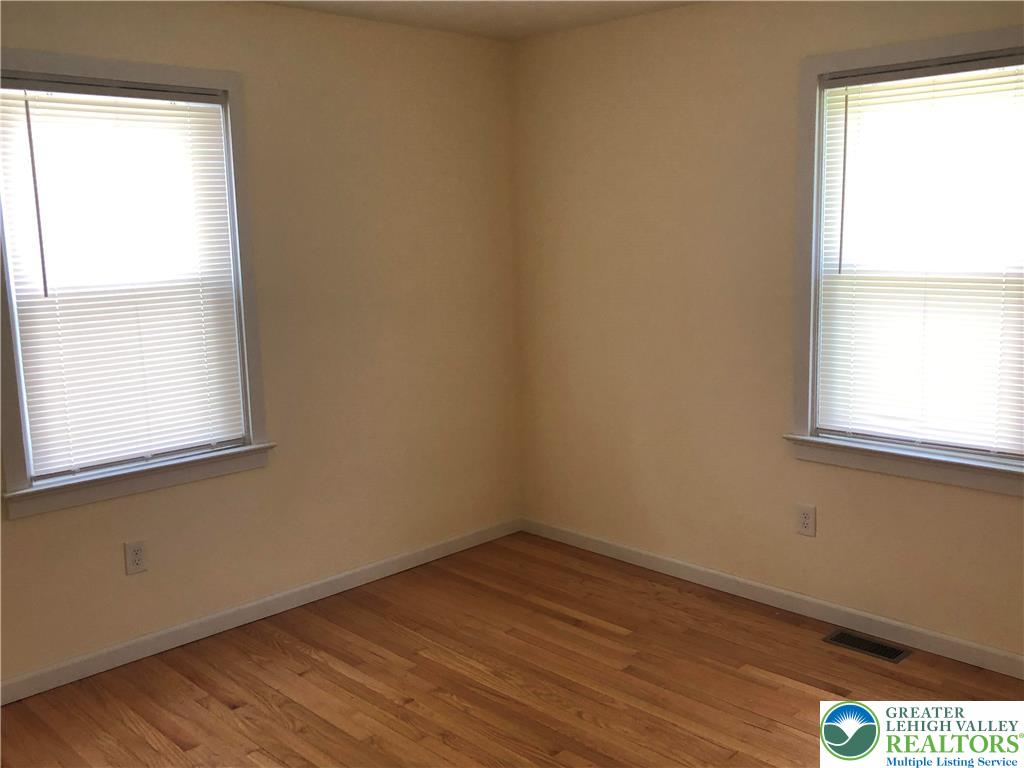 1931 Meadows Road Hellertown, PA 18055 - Photo 13 of 20 wooden floor in an empty room with a window
