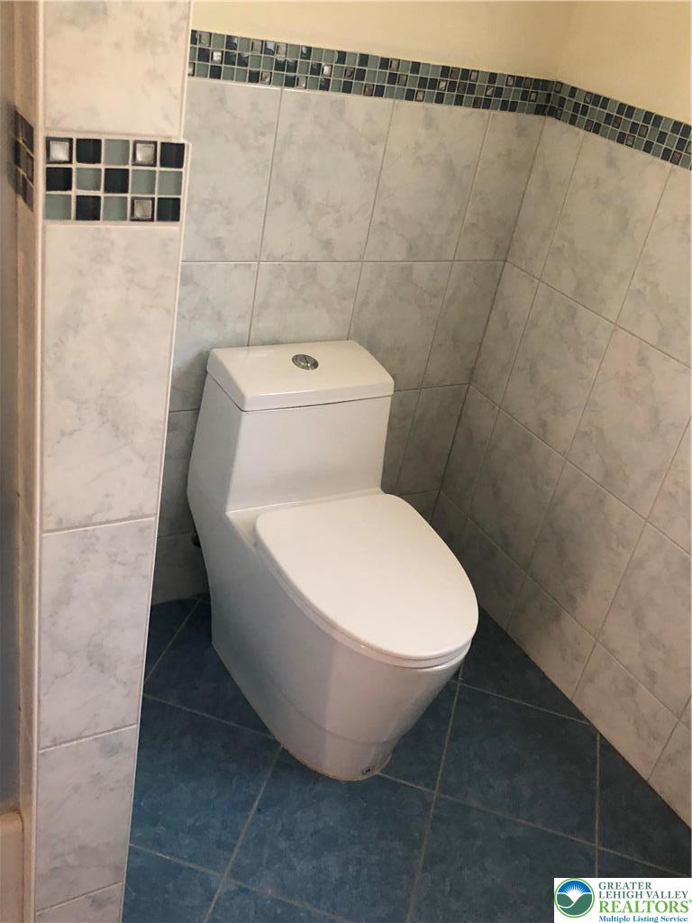 1931 Meadows Road Hellertown, PA 18055 - Photo 15 of 20 a white toilet sitting in a bathroom next to a white wall