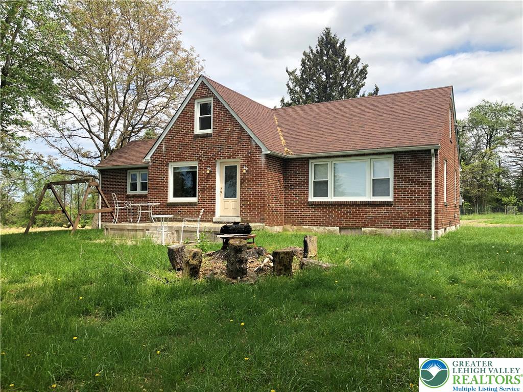 1931 Meadows Road Hellertown, PA 18055 - Photo 3 of 20 a backyard of a house with table and chairs