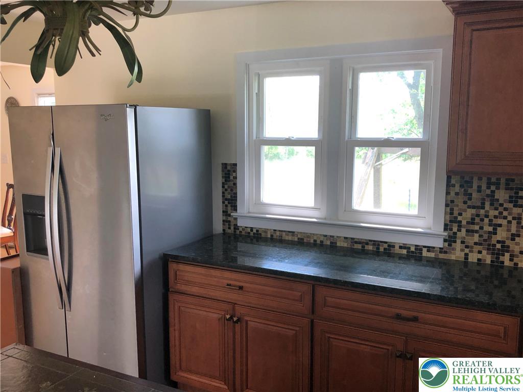1931 Meadows Road Hellertown, PA 18055 - Photo 9 of 20 a kitchen with stainless steel appliances granite countertop a refrigerator and a sink