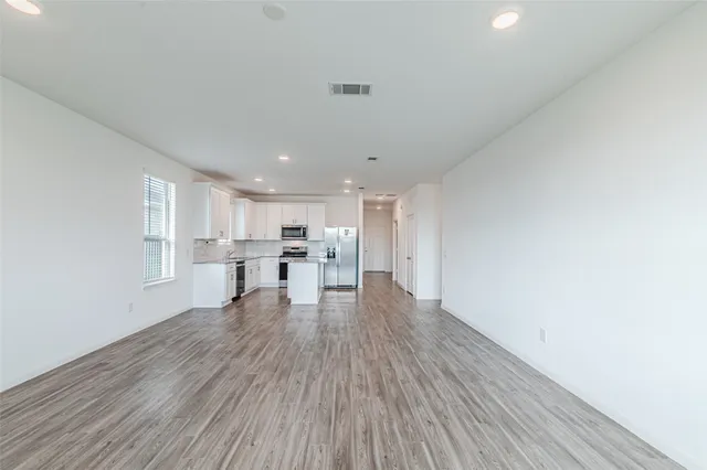 a view of kitchen with wooden floor