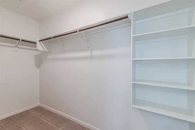 a bathroom with a sink toilet and mirror