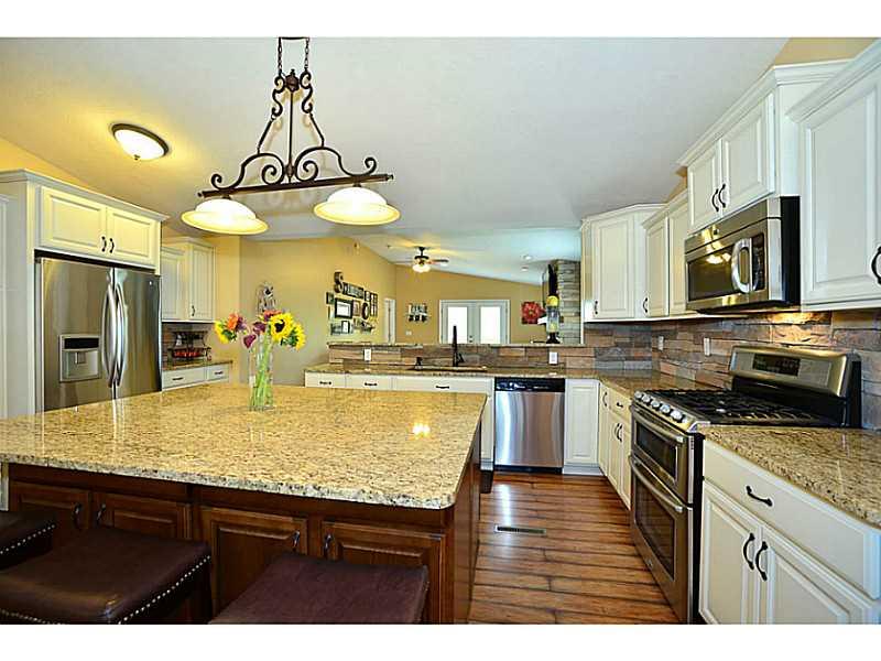 932 Mcelhaney Road Freedom, PA 15042 - Photo 2 of 25 Kitchen. Kraftmaid soft close cabinets with granite tops open to the living room and dining room.