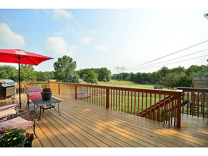932 Mcelhaney Road Freedom, PA 15042 - Photo 20 of 25 Patio/Deck. The 36x12 deck overlooks this AMAZING rear yard! A picket fence surrounds the play and pool area, and a taller fence suited for large dogs surrounds the rest of the HUGE level rear yard!
