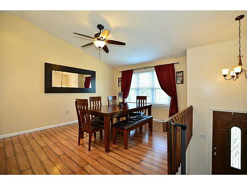 932 Mcelhaney Road Freedom, PA 15042 - Photo 4 of 25 Dining Room. Large open concept dining, kitchen, and living room with vaulted ceilings.