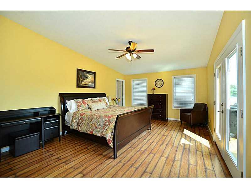 932 Mcelhaney Road Freedom, PA 15042 - Photo 8 of 25 Master Bedroom. 20x13 Master retreat is light and bright with 2 windows and french doors to the deck.