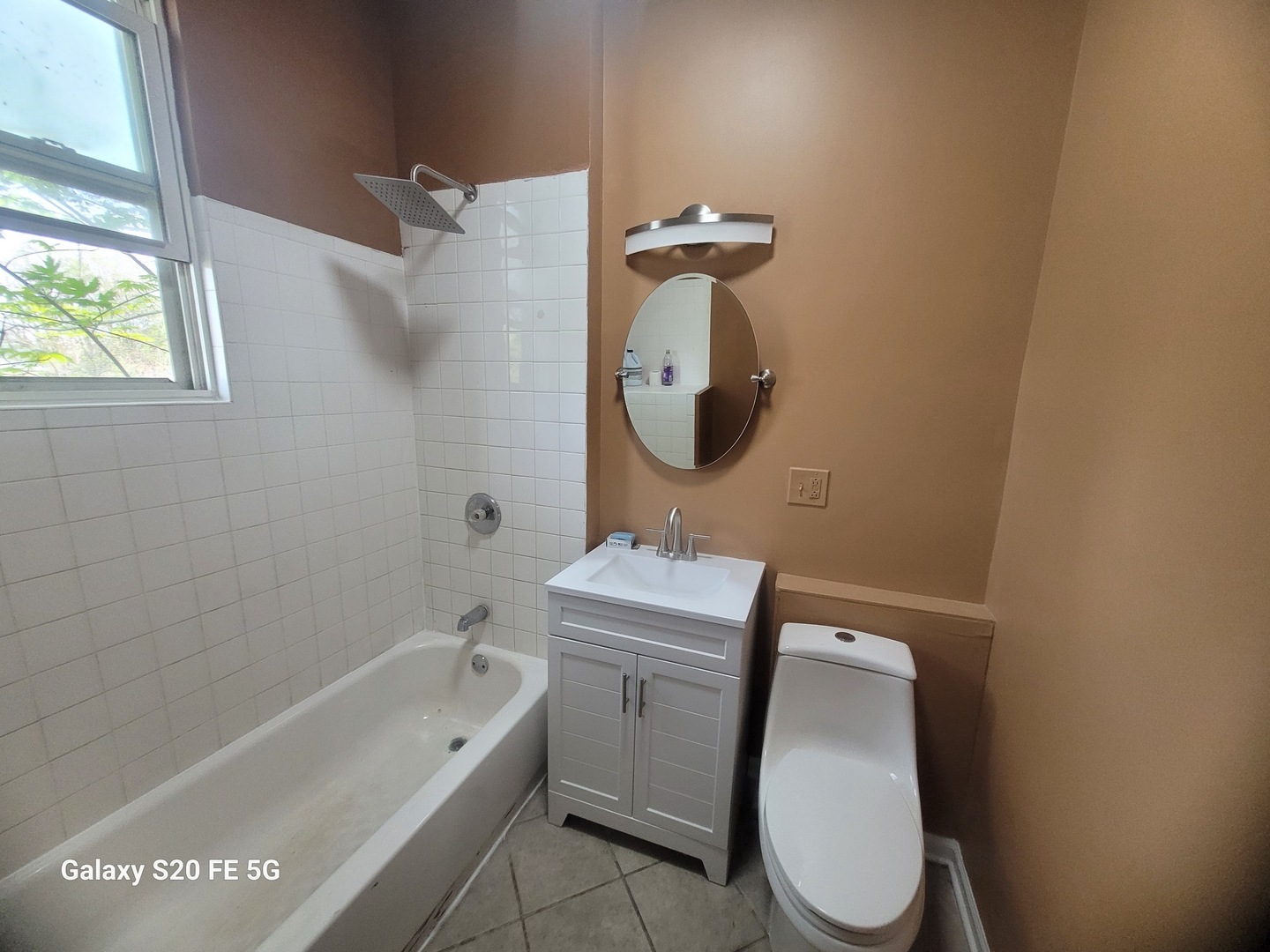 6953 South Loomis Boulevard Chicago, IL 60636 - Photo 12 of 13 a bathroom with a toilet sink and mirror