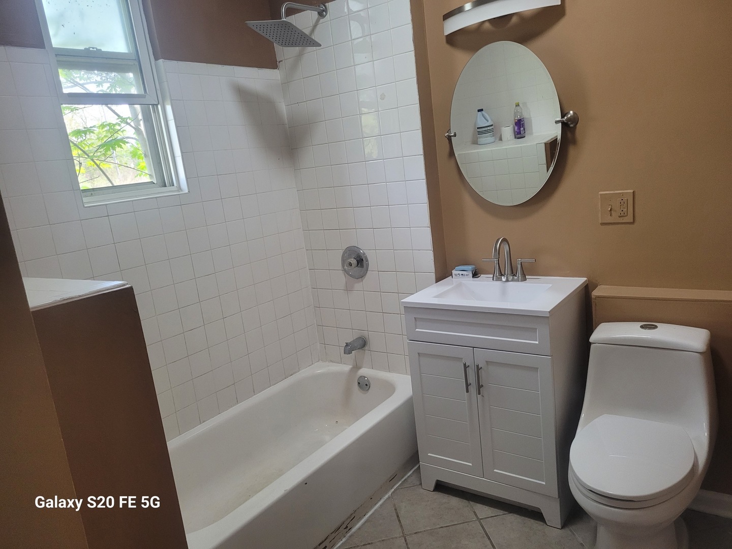 6953 South Loomis Boulevard Chicago, IL 60636 - Photo 13 of 13 a bathroom with a sink a toilet and a mirror