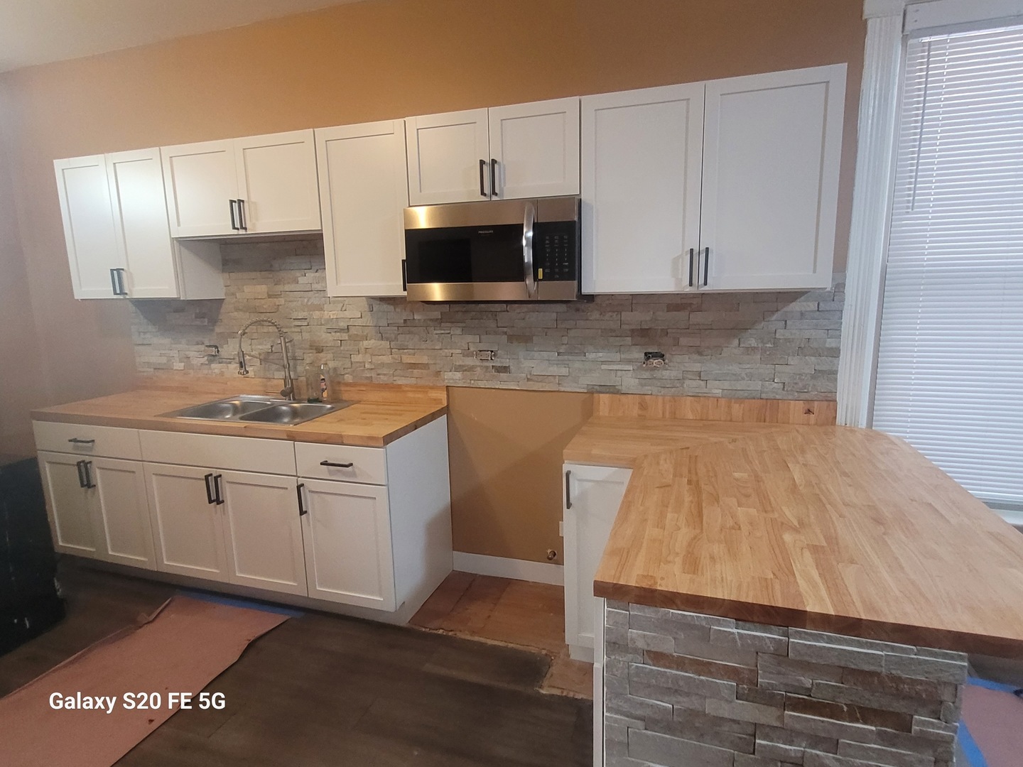 6953 South Loomis Boulevard Chicago, IL 60636 - Photo 6 of 13 a kitchen with granite countertop white cabinets and white appliances