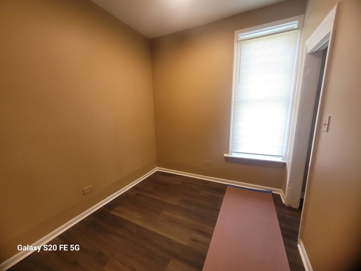 6953 South Loomis Boulevard Chicago, IL 60636 - Photo 9 of 13 an empty room with a window