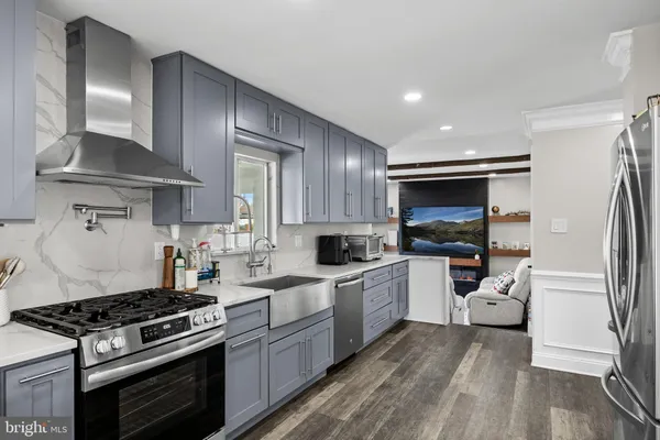 a kitchen with a stove and a refrigerator